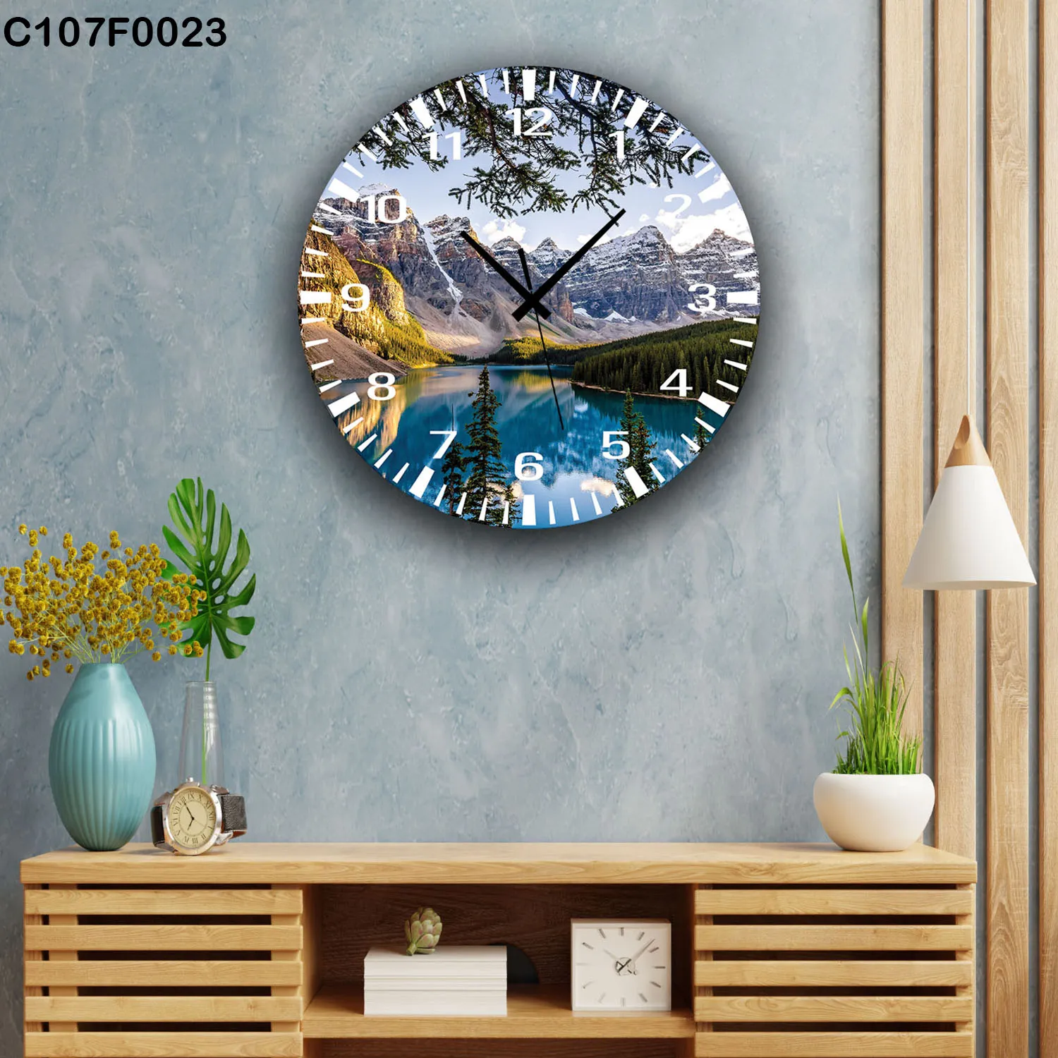 ساعة دائرية بحيرة زرقاء و جبال ثلجية